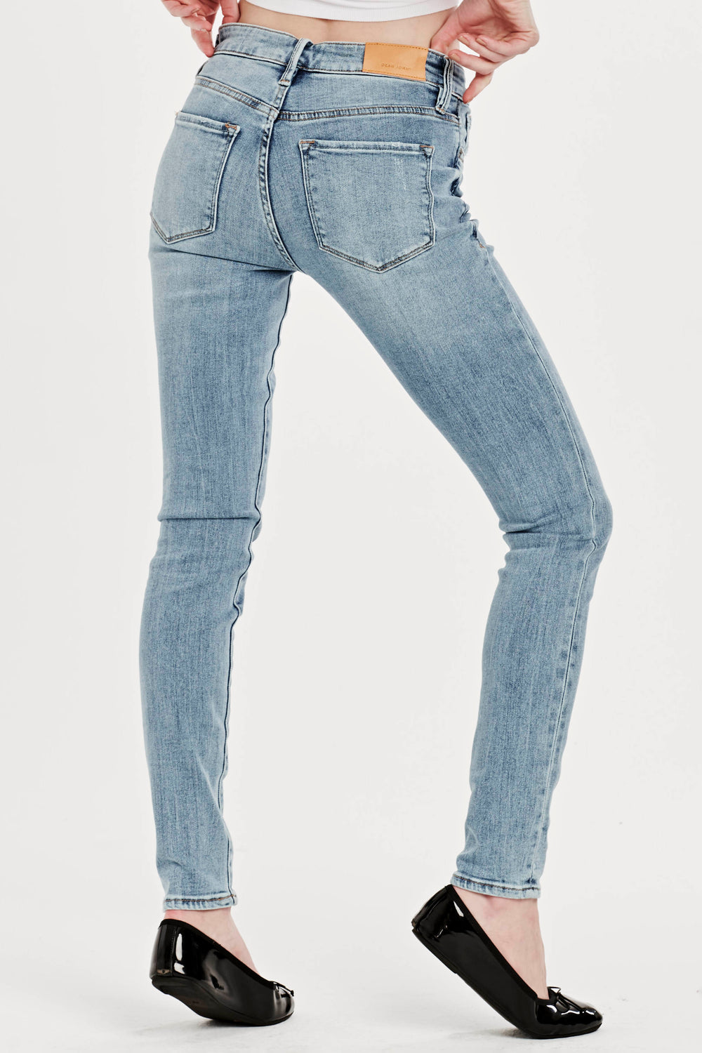 image of a female model wearing a GISELE HIGH RISE ANKLE SKINNY JEANS PORTMORE DEAR JOHN DENIM 