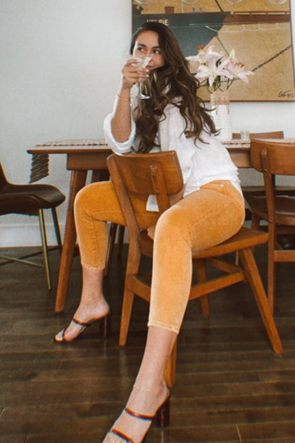 image of a female model wearing a 10" PIXIE SKINNY MIMOSA JEANS